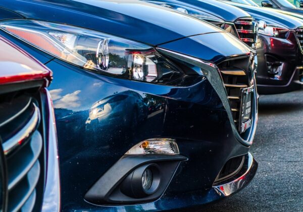 Row of a fleet of cars lined up in a carpark